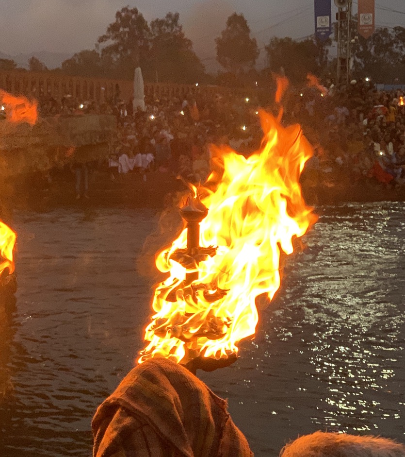 Samvara participating in a fire arti near Rishikesh, India